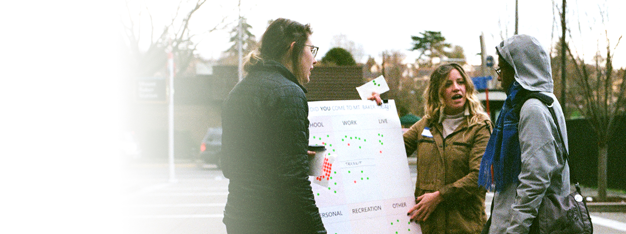 Students engaging with people at the Mt Baker Transit Station