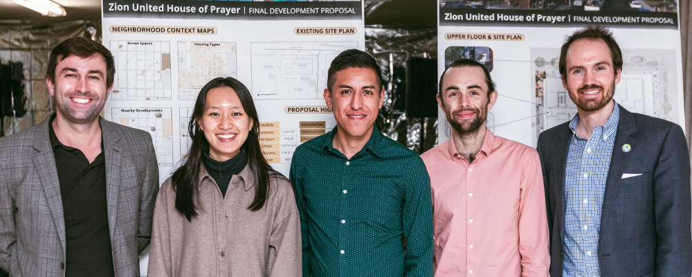 Students standing in front of a poster board