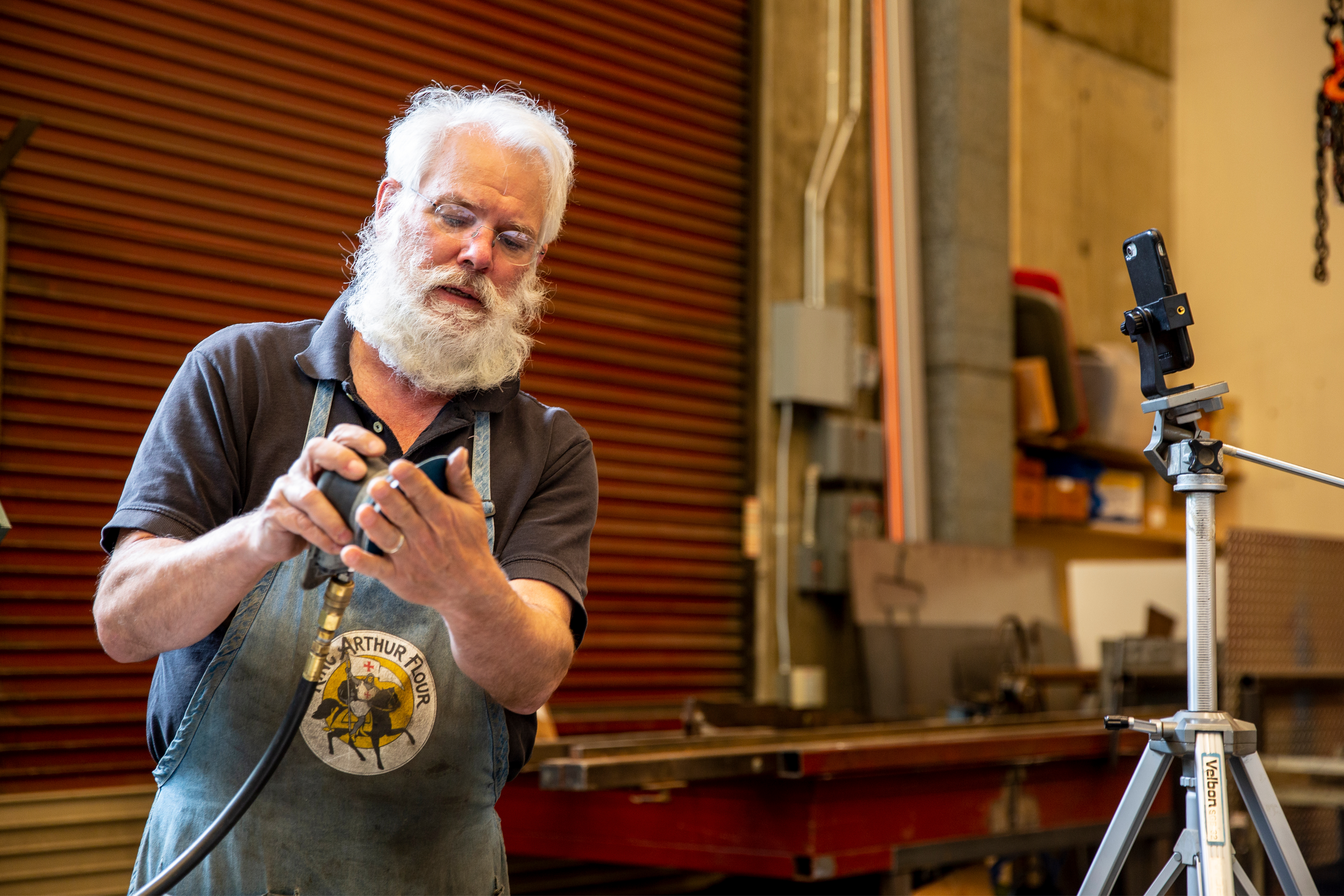 Professor Griggs showing students how a tool works