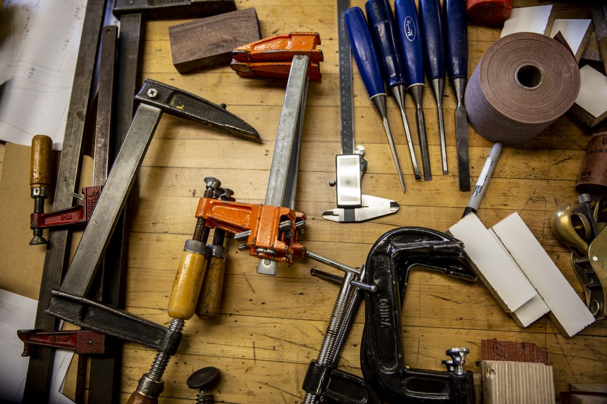 A variety of tools on a wood surface