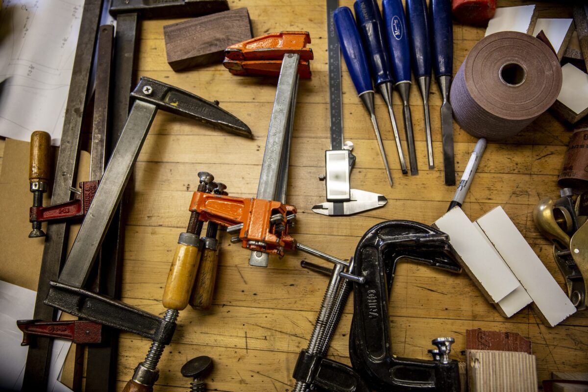 A variety of tools on a wood surface