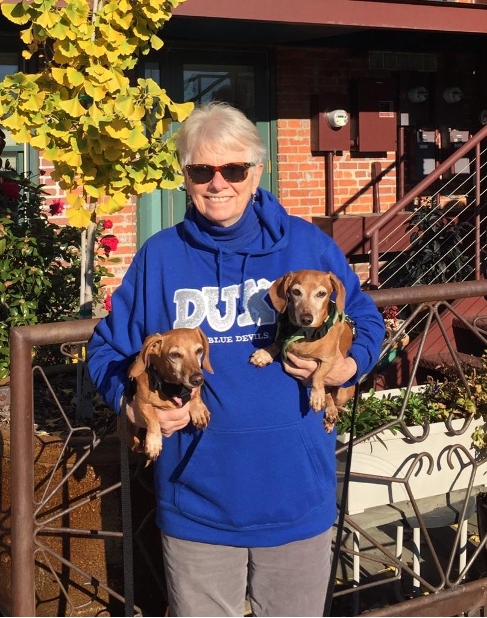 Sally holding her two Dachshunds