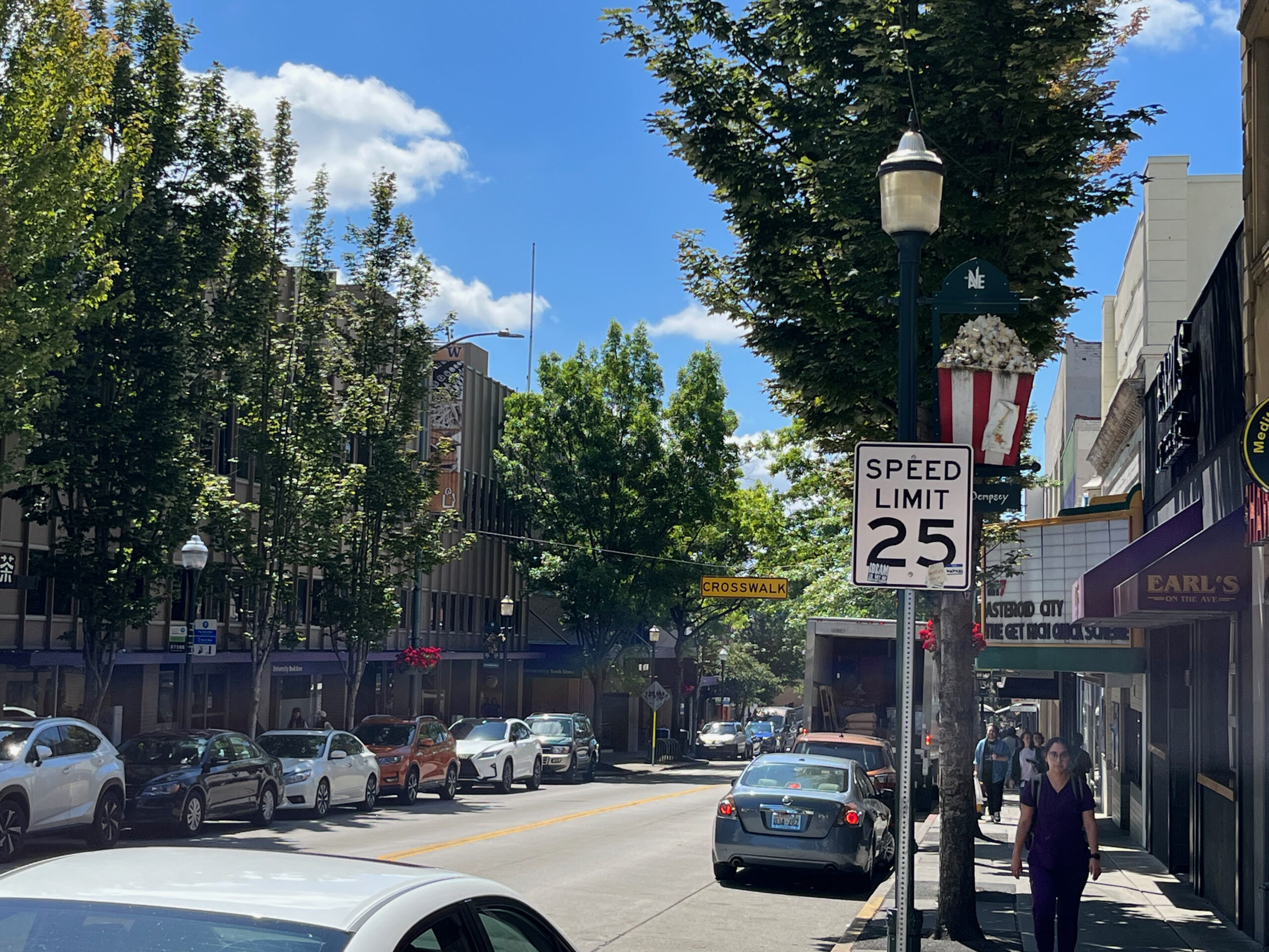 A view of down the street and sidewalk of the Ave