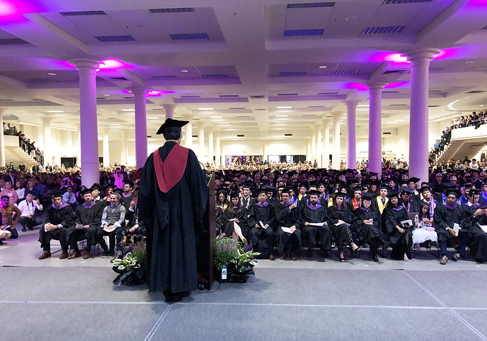 Dean Cheng on stage at graduation