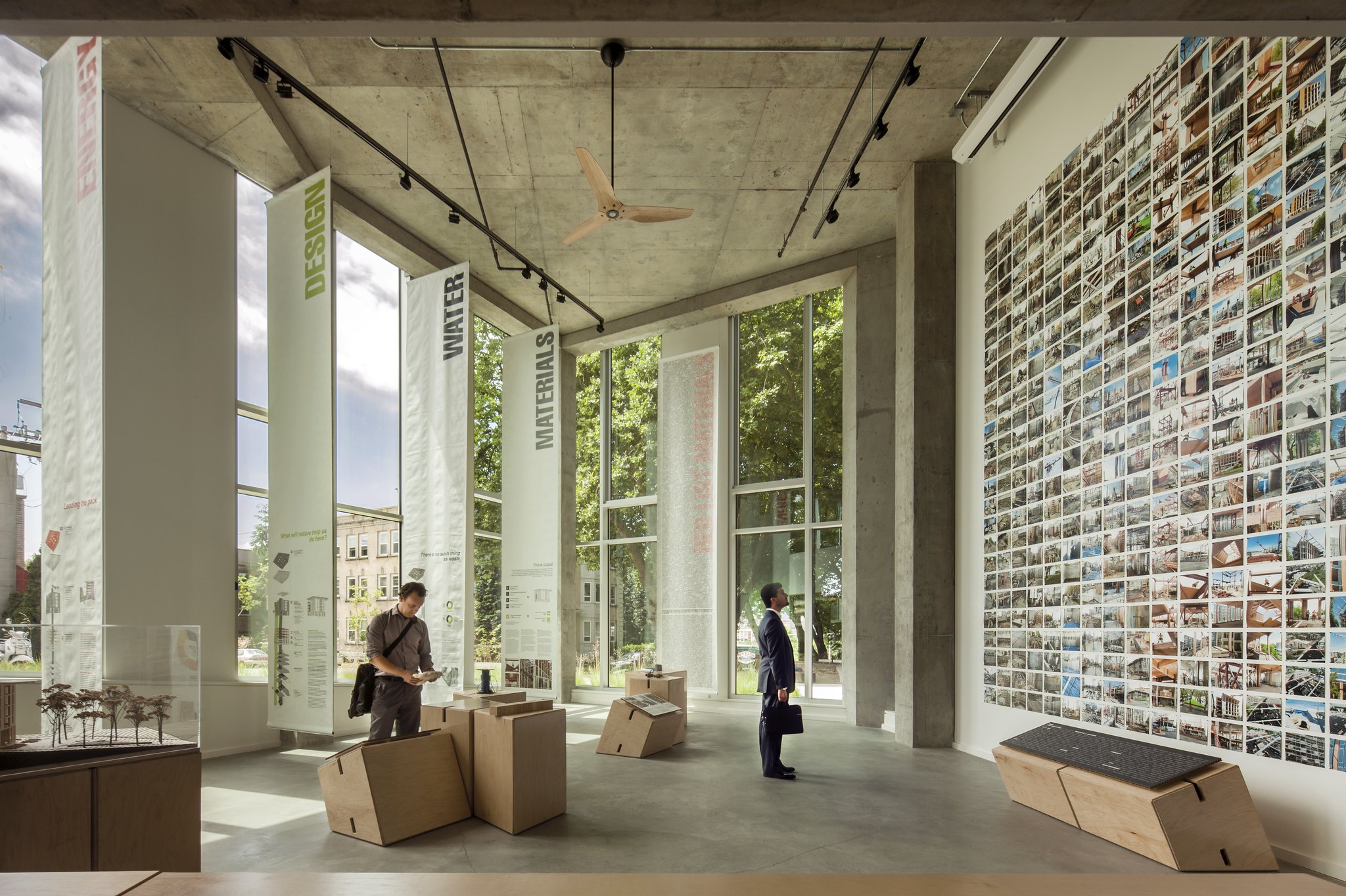 Large concrete room with people in it