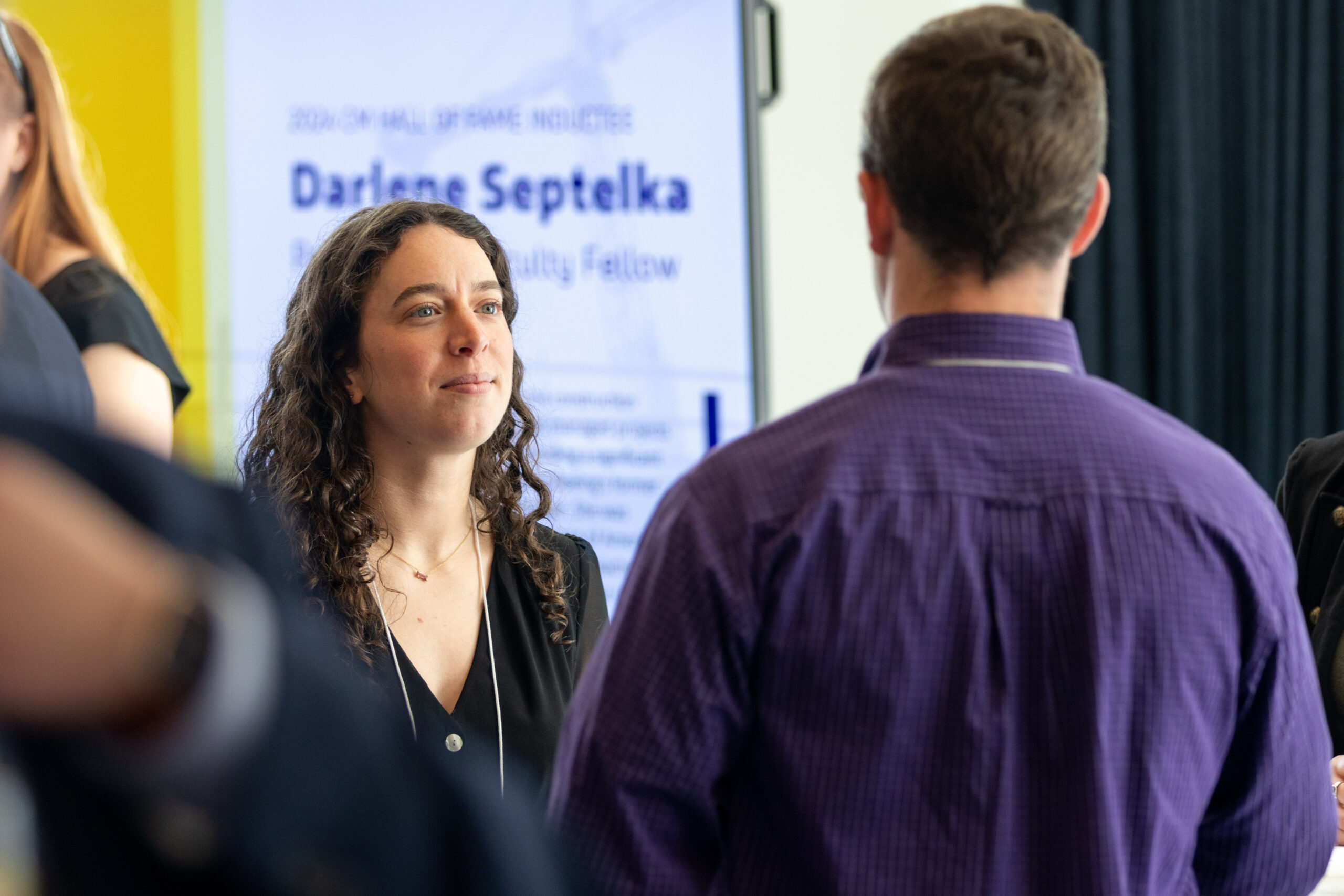 Student looking at person in a crowd of people