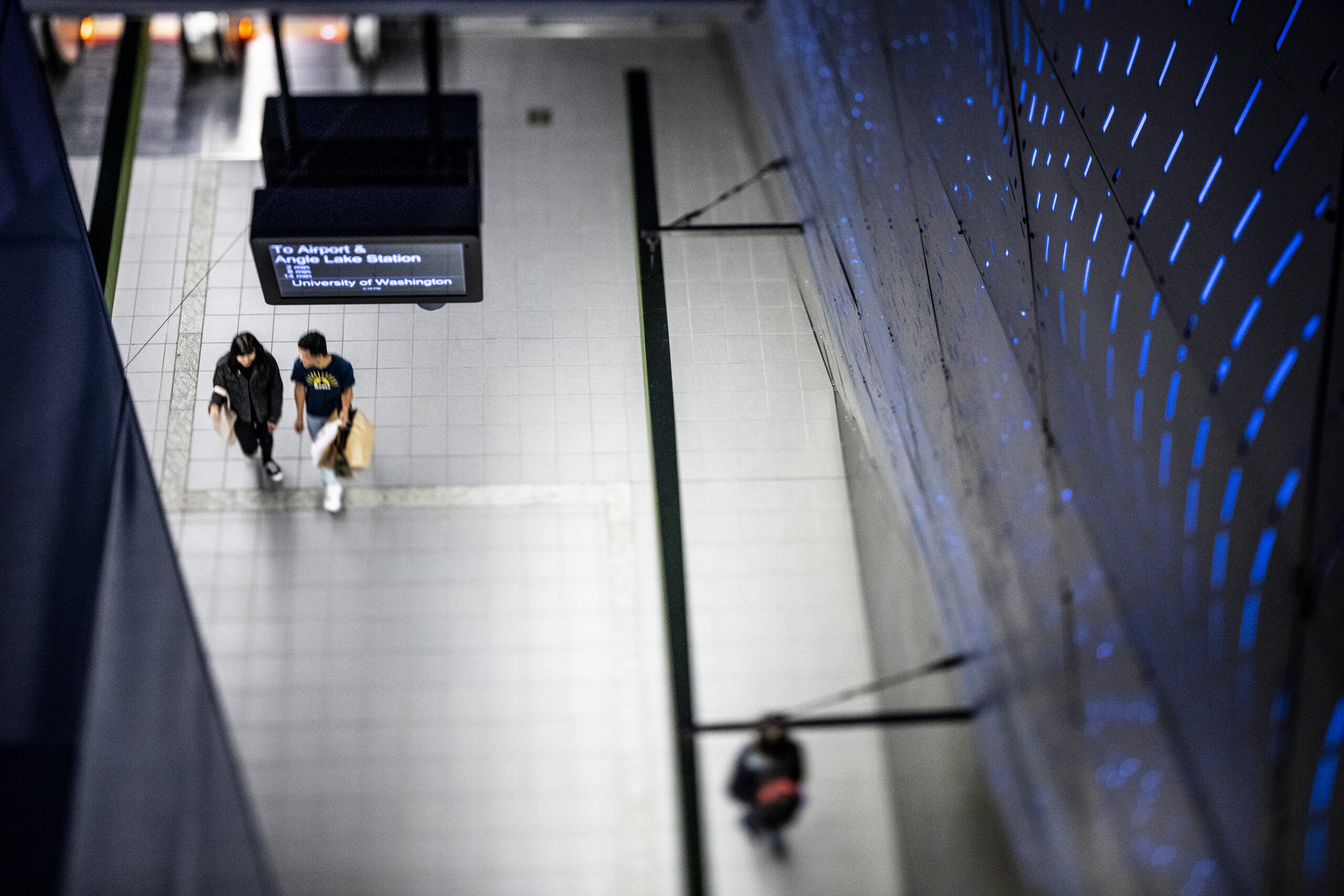 overheard photo of people walking in a transit station