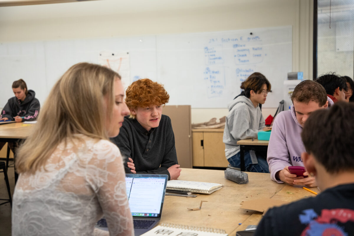 Students working around a table