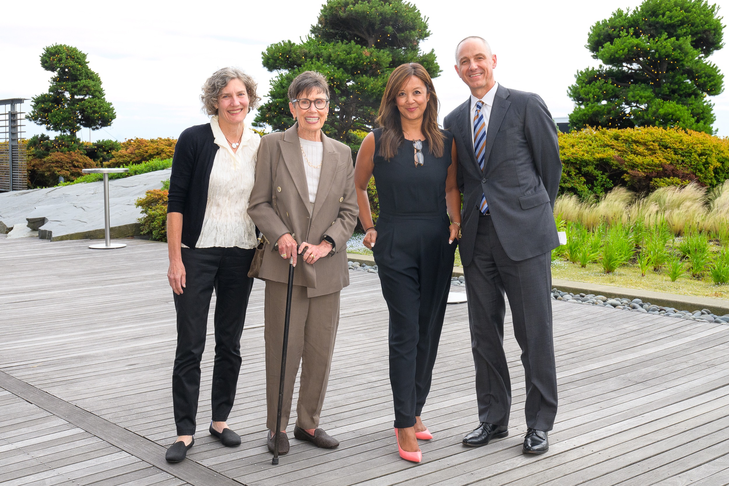 Four people standing together