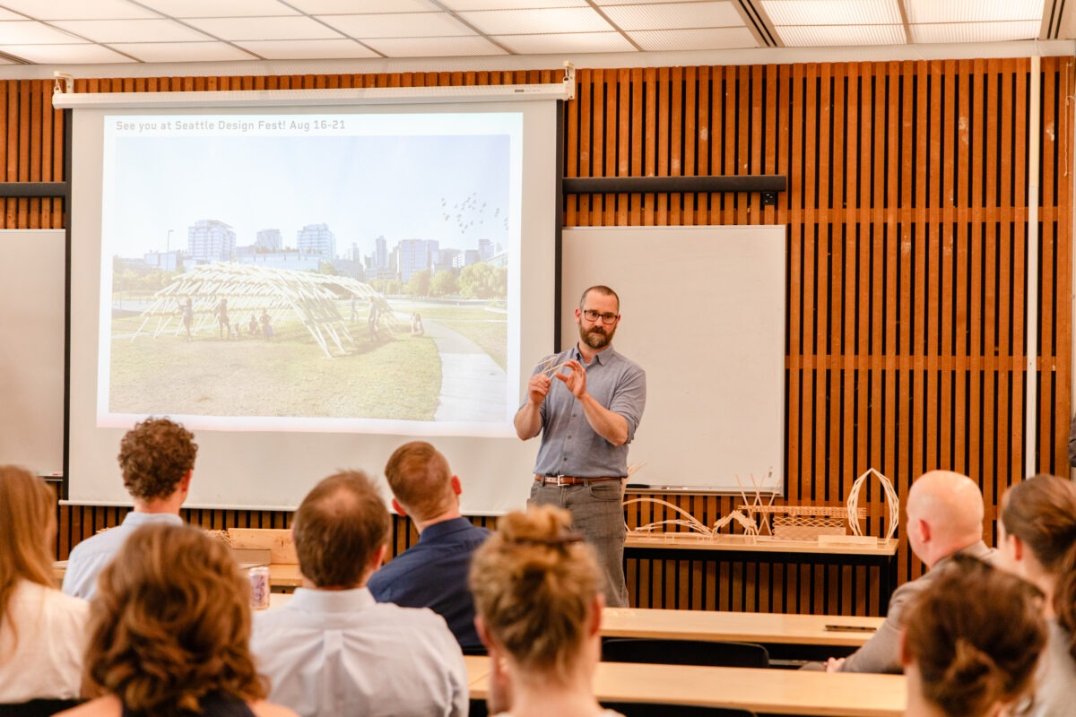 Tyler Sprague showing model in final review of Onouye Studio