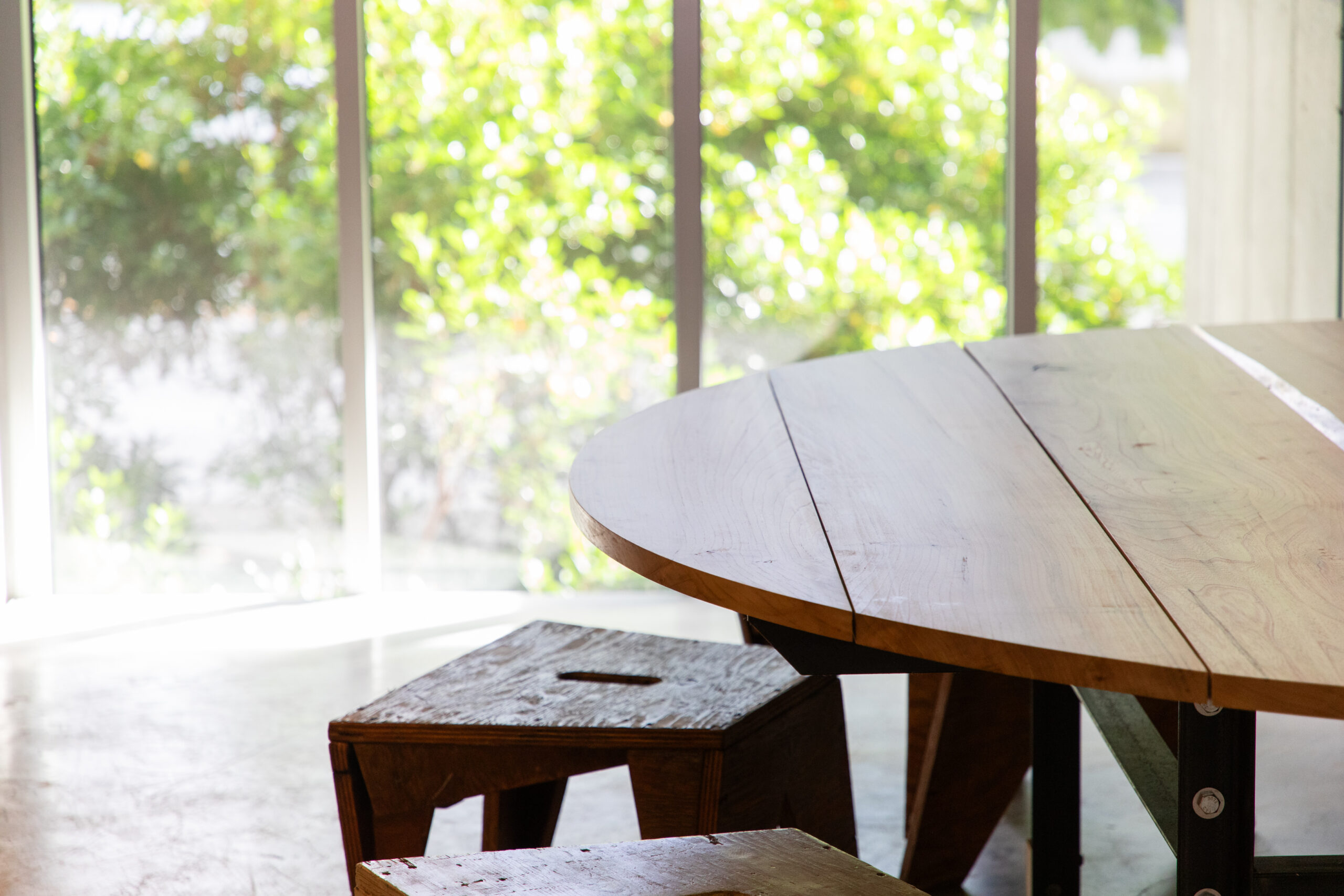 Close up of table edge with bench in background