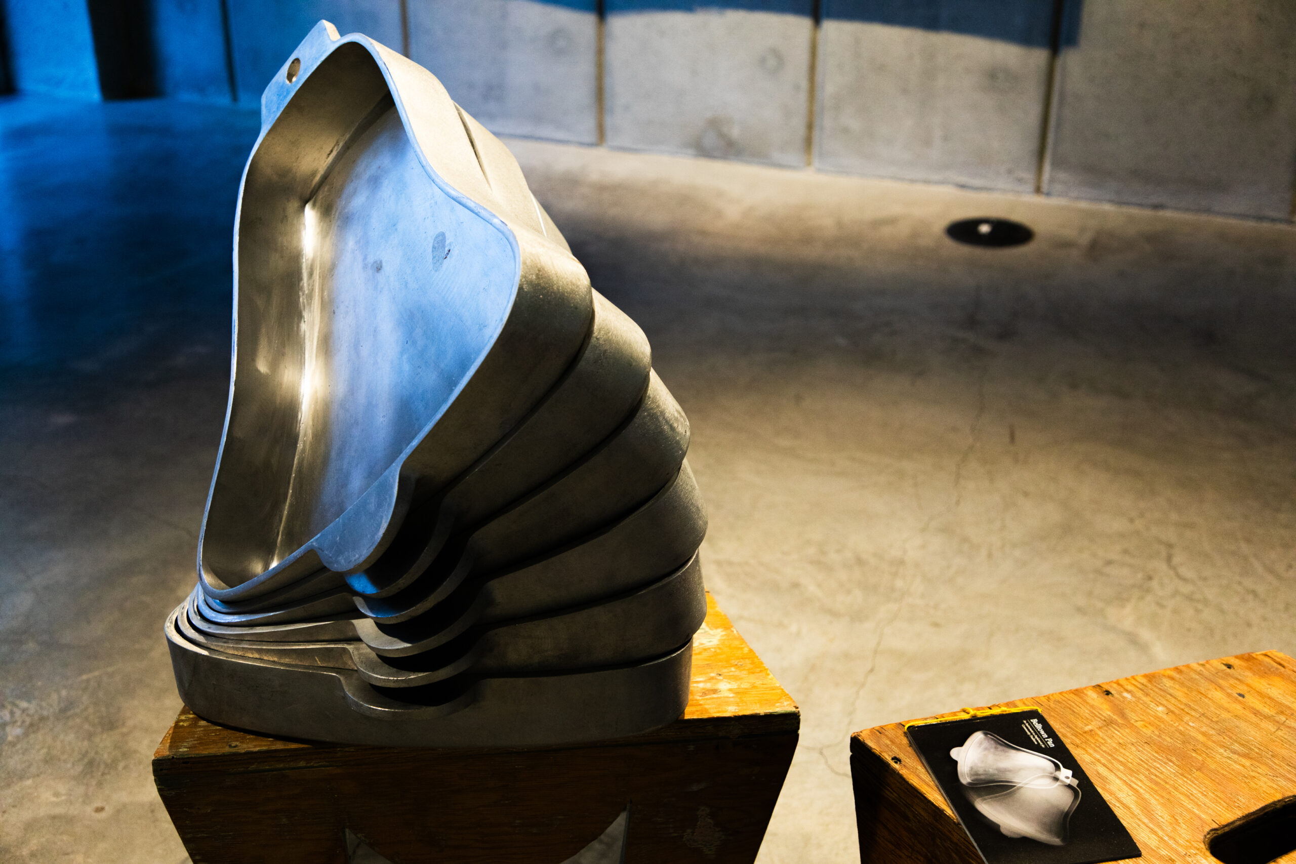 Stacked bell-shaped metal pans