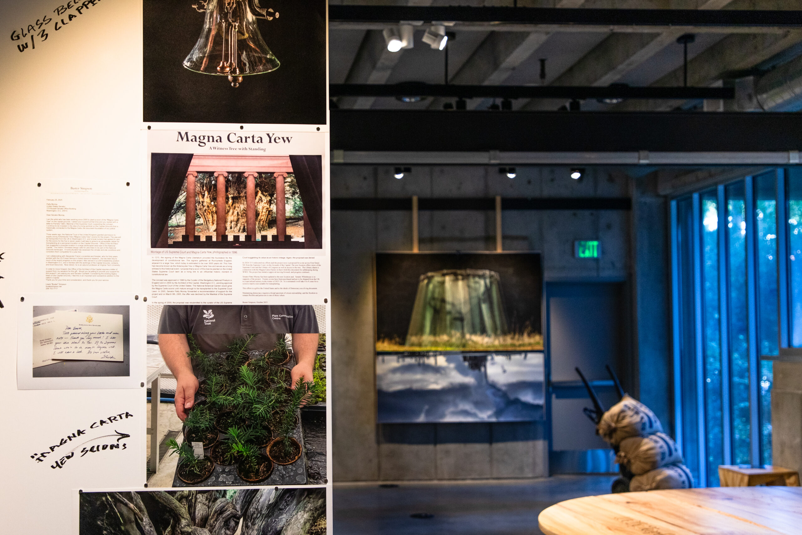 Posters up with exhibit items in the background