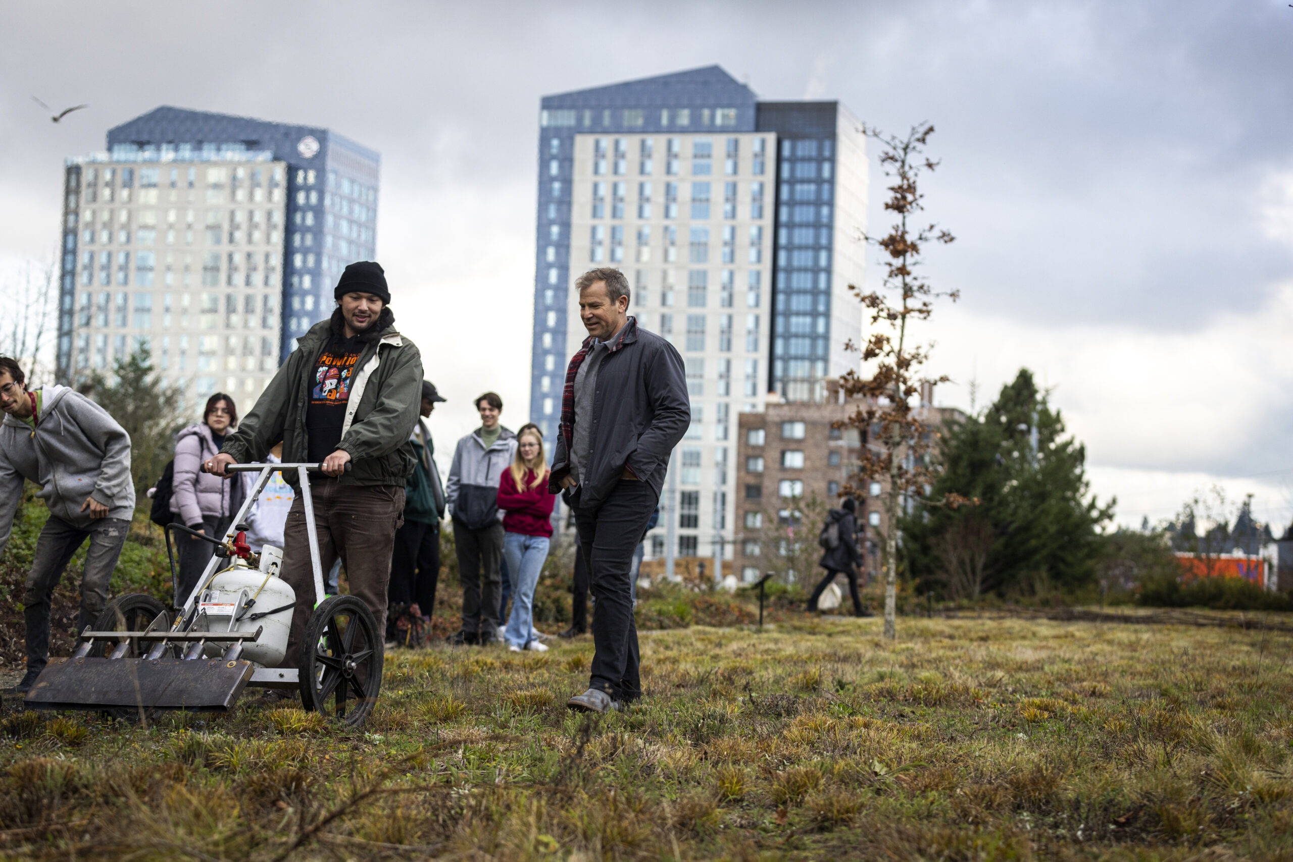 Dean Yocom and students doing a controlled burn in Burke Meadow
