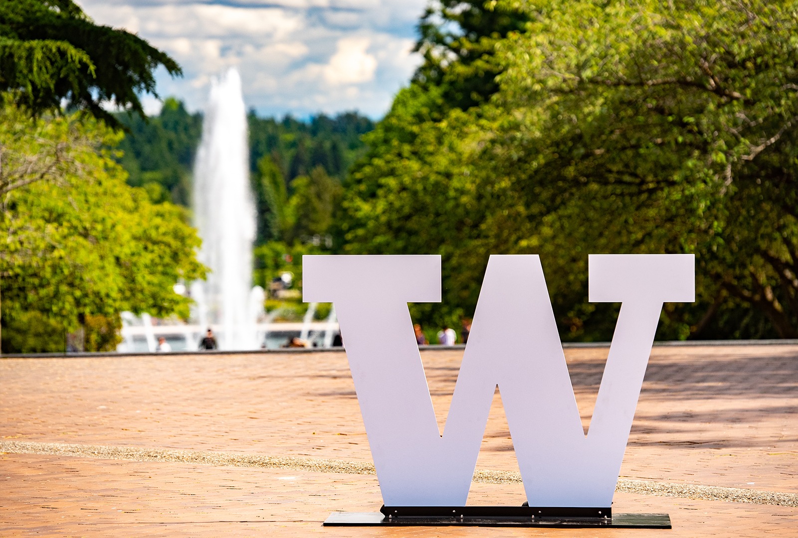 W in front of fountain