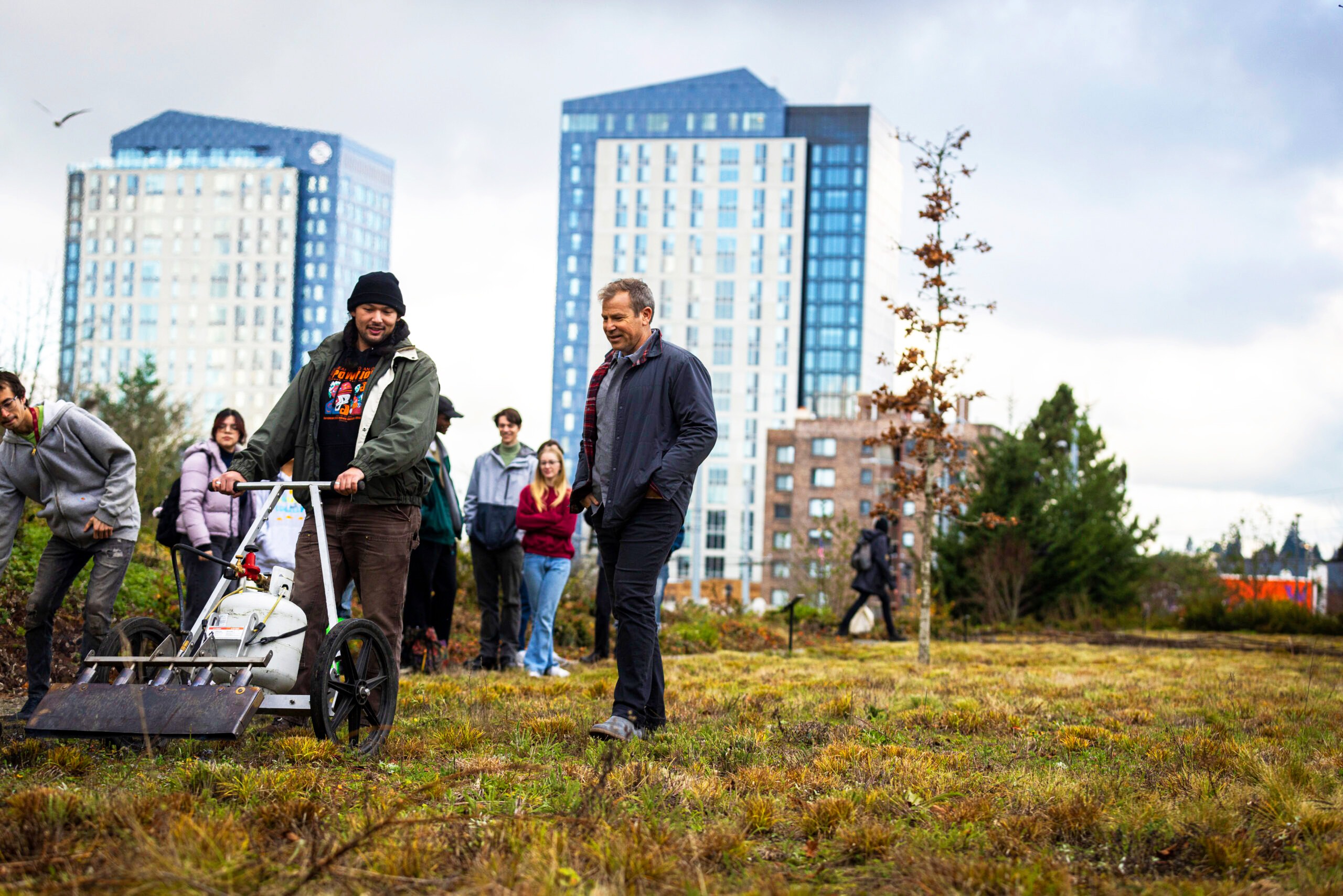 Dean walks with student in Burke meadow