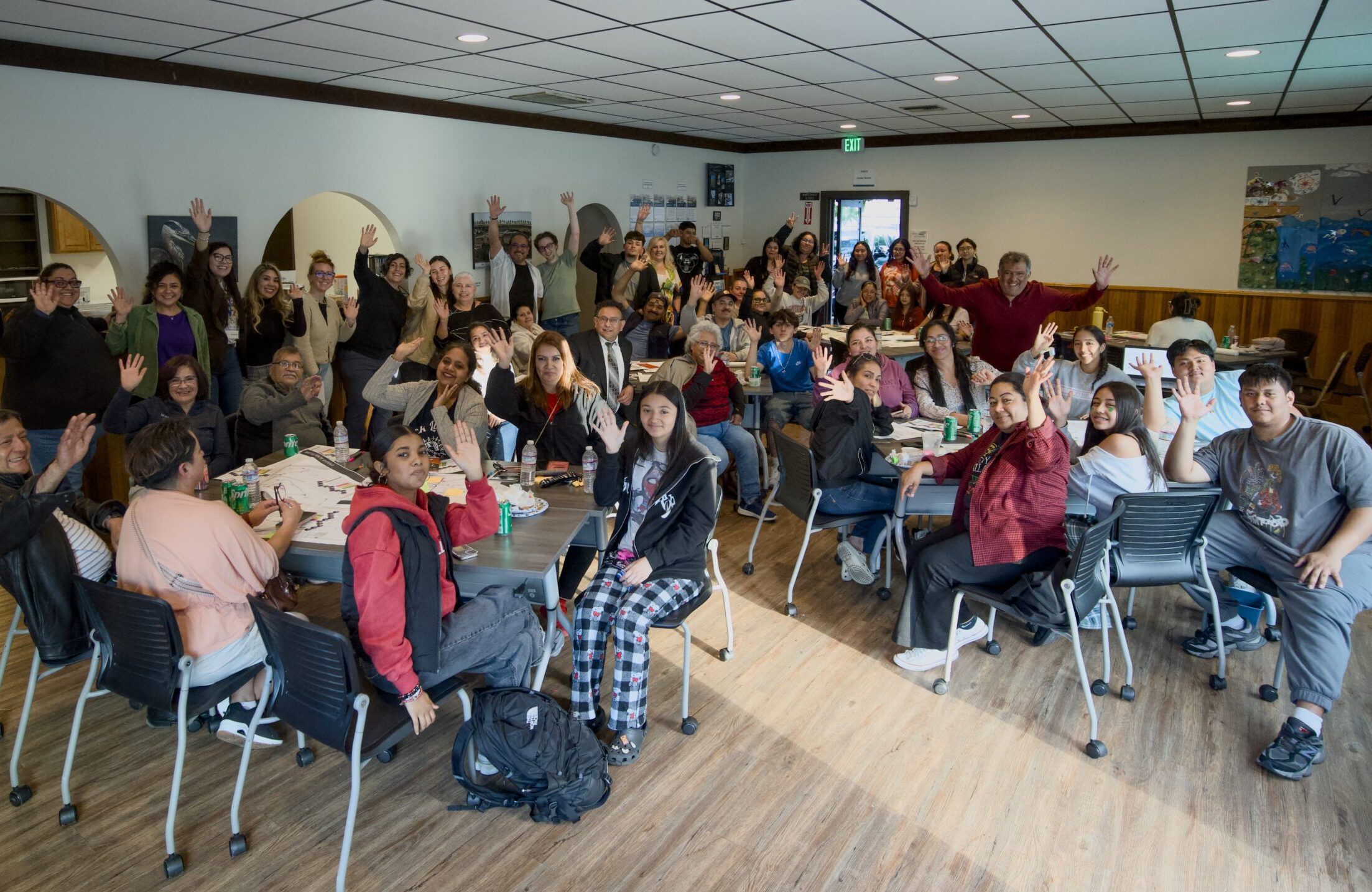 Group of people waving