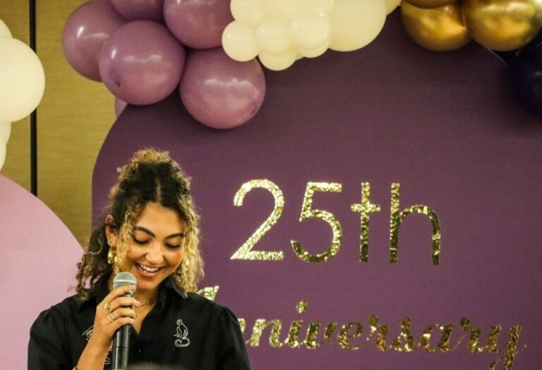 Jannon-Shields speaking into a microphone