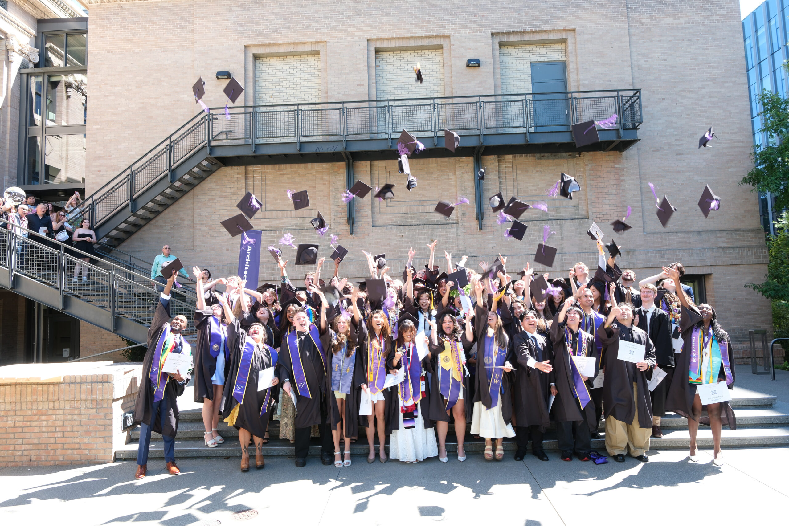 Students throwing caps in air
