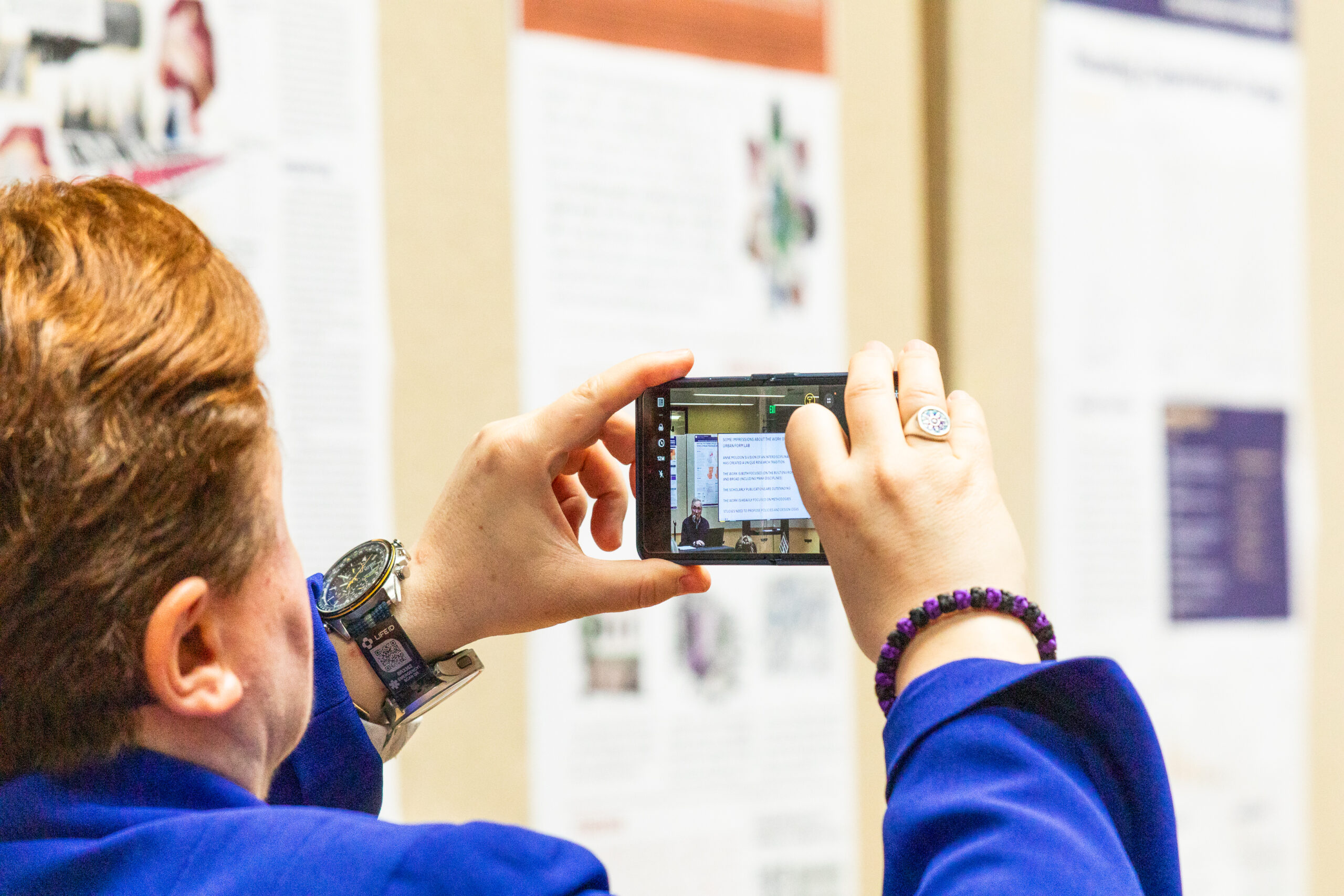 Person taking photo of presentation